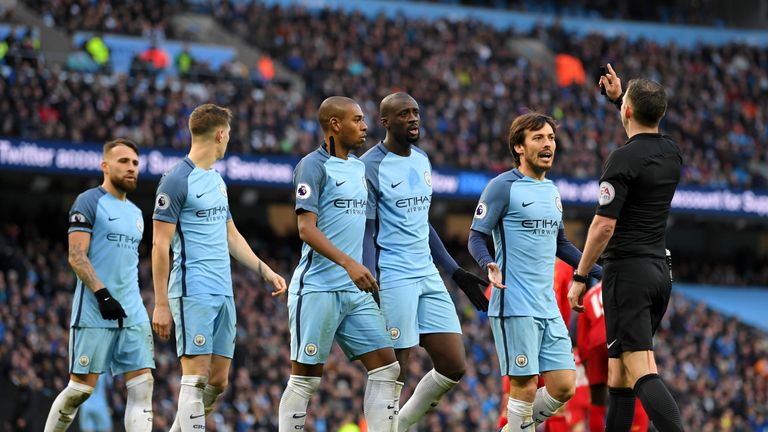 MANCHESTER, ENGLAND - MARCH 19:  The Manchester City team plead with referee Michael Oliver after he awards a penalty to Liverpool during the Premier Leagu
