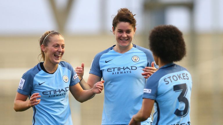 MANCHESTER, ENGLAND - OCTOBER 30:  Demi Stokes of Manchester City (R) celebrates scoring her sides first goal with her Manchester City team mates during Wo