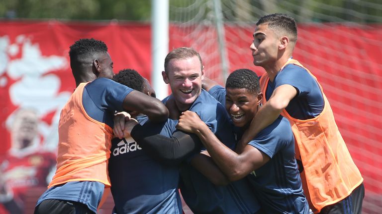 Axel Tuanzebe, Timothy Fosu-Mensah, Wayne Rooney, Marcus Rashford and Andreas Pereira joke around during Man United training