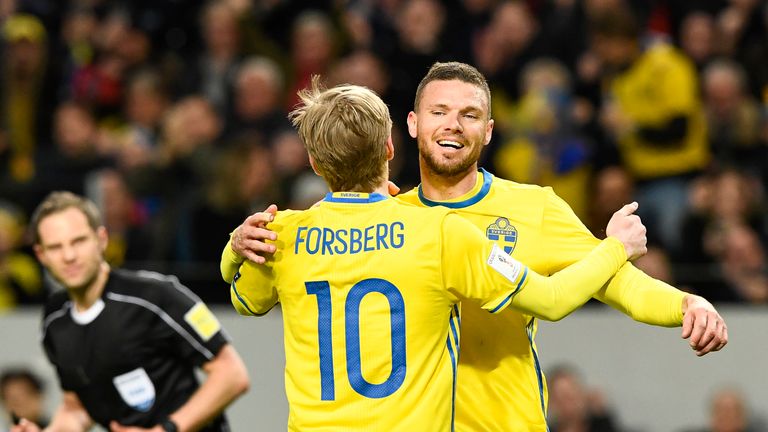 Sweden's midfielder Emil Forsberg celebrates with his teammate forward Marcus Berg (R) after scoring  during the FIFA World Cup 2018 qualification football