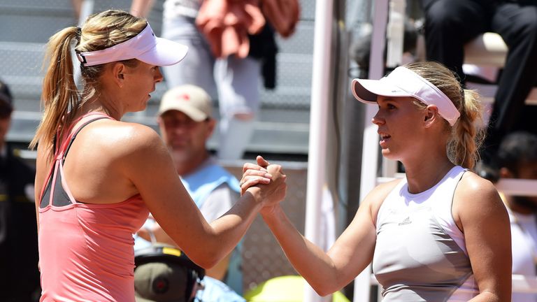 Russian tennis player Maria Sharapova (L) greets Danish tennis player Caroline Wozniacki after defeating her during the Madrid Open tournament at the Caja 