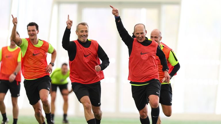 Mike Dean recreates his famous "celebration" after playing an advantage