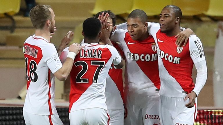 Monaco's French forward Kylian Mbappe Lottin (2-R) celebrates with teammates after scoring a goal during the French L1 football match Monaco (ASM) versus N