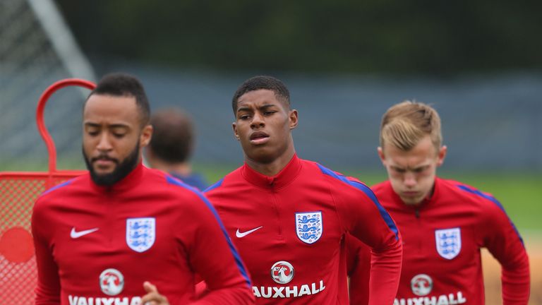 BURTON-UPON-TRENT, ENGLAND - SEPTEMBER 05:  Marcus Rashford, Nathan Redmond and James Ward-Prowse of England U21's warm up during a training session at St 