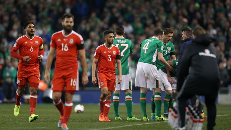 Wales' Neil Taylor (centre) is sent off following the tackle in Dublin