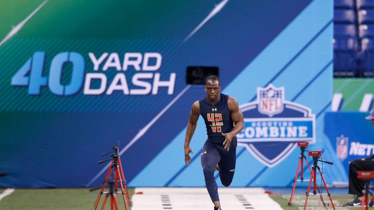 Wide receiver John Ross of Washington runs the 40-yard dash in 4.22 seconds