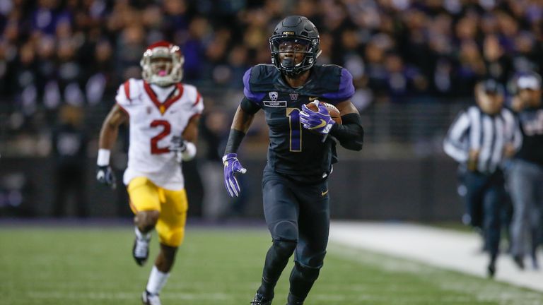 Wide receiver John Ross #1 of the Washington Huskies scores a touchdown against the USC Trojans 