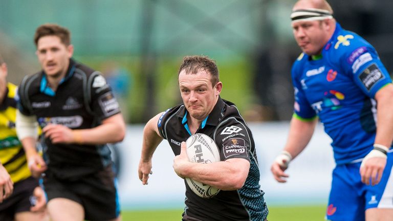 Nick Grigg runs in a try for Glasgow