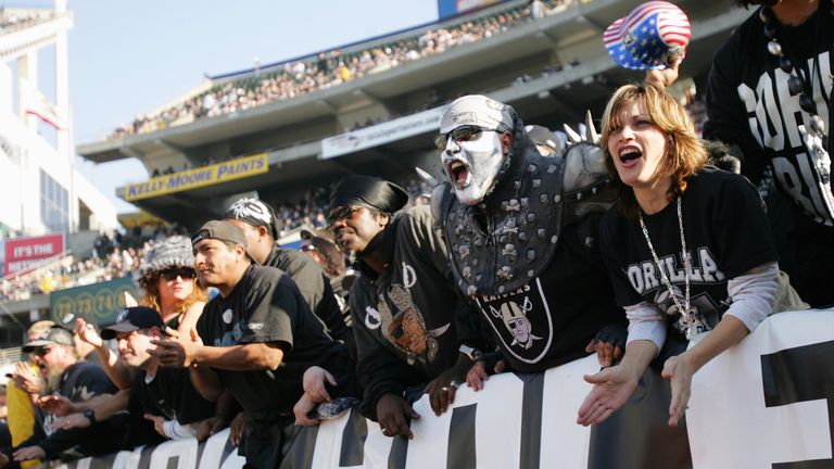 Fans cheer on the Raiders at the Oakland Coliseum