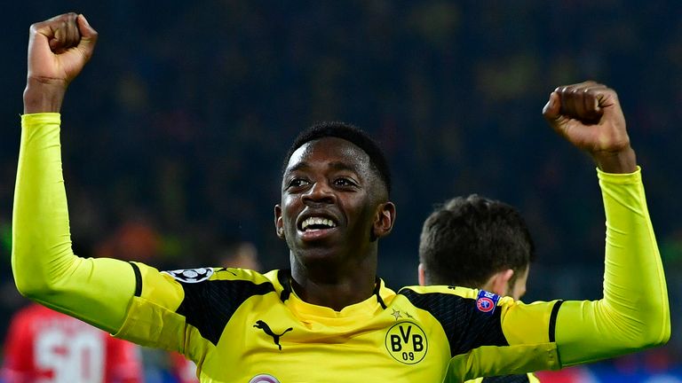 Dortmund's French midfielder Ousmane Dembele celebrates after his teammate Aubameyang scored the 3-0 goal during the UEFA Champions League Round of 16, 2nd