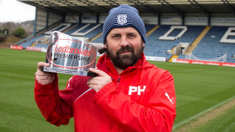 Paul Hartley is presented with the Premiership Manager of the Month award