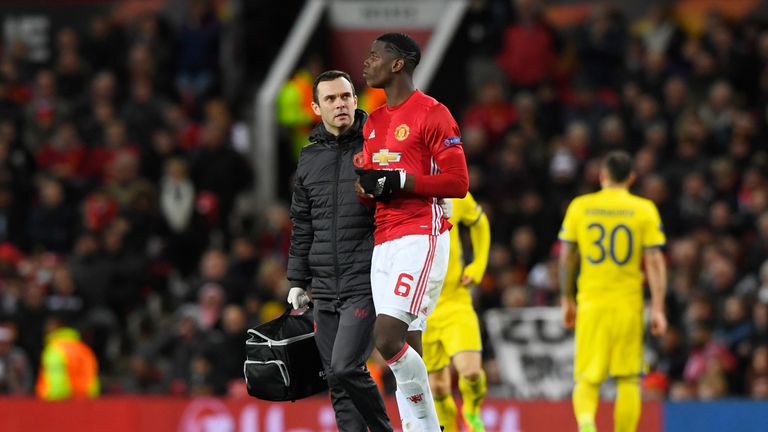 Manchester United's Paul Pogba leaves the pitch due to injury at Old Trafford 