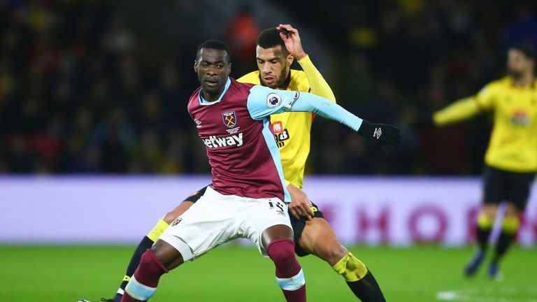 Pedro Obiang and Etienne Capoue battle for possession at Vicarage Road