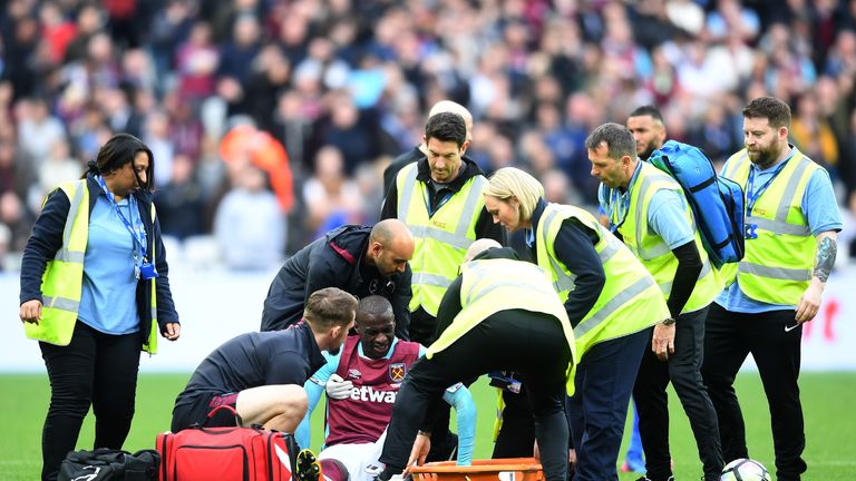 Pedro Obiang receives treatment after injuring his ankle against Leicester