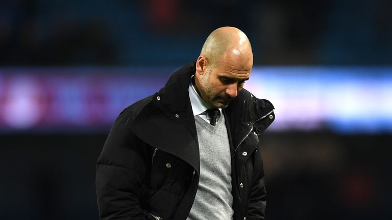 MANCHESTER, ENGLAND - MARCH 08:  Josep Guardiola, Manager of Manchester City looks dejected after the full time whistle during the Premier League match bet