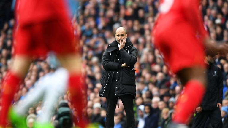 Pep Guardiola looks on from his technical area