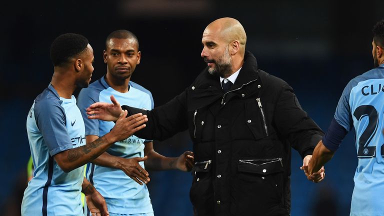 MANCHESTER, ENGLAND - MARCH 01:  Josep Guardiola manager of Manchester City celebrates with Raheem Sterling, Fernandinho and Gael Clichy of Manchester City