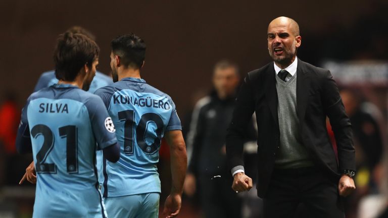 MONACO - MARCH 15:  Josep Guardiola manager of Manchester City gives instructions to David Silva (21) and Sergio Aguero of Manchester City (10) during the 