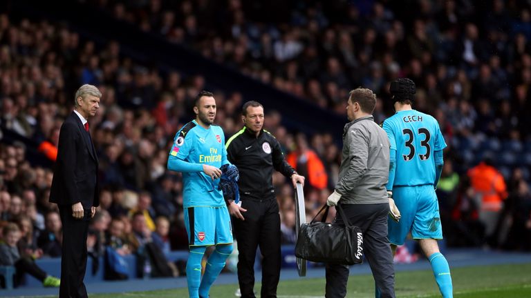 Arsenal goalkeeper David Ospina replaces goalkeeper Petr Cech after he picks up an injury during the Premier League match at The Hawthorns, West Bromwich.