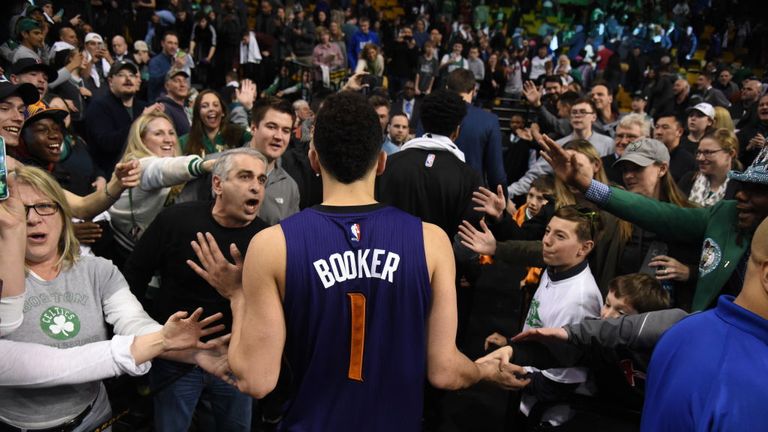 BOSTON, MA - MARCH 24: Suns high-fives with fans after scoring 70 points against the Boston Celtics on March 24, 2017 at the TD Garden in Boston