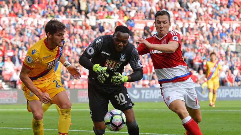 Stewart Downing challenges Steve Mandanda during the Premier League match between Middlesbrough and Crystal Palace