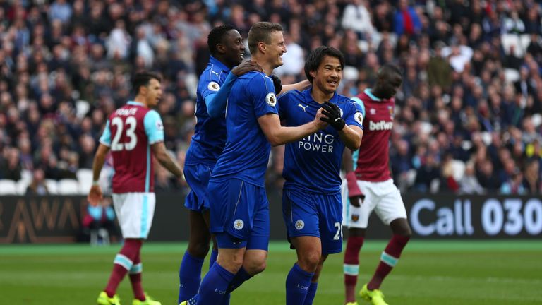 Robert Huth of Leicester City (C) celebrates scoring his side's second goal with Shinji Okazaki during the Premier League clash with West Ham