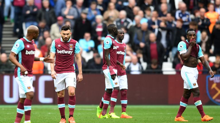 The West Ham players look dejected after Leicester City score their third goal during the Premier League match at the King Power