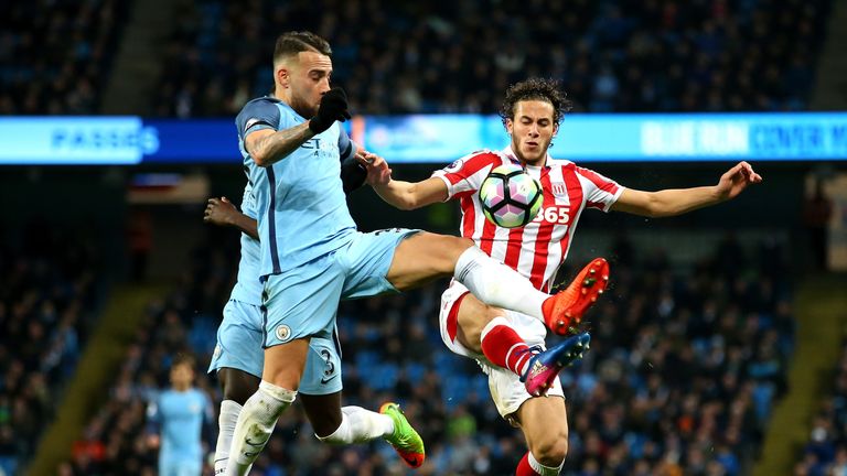 Nicolas Otamendi of Manchester City and Ramadan Sobhi of Stoke City in action during the Premier League match at the Etihad