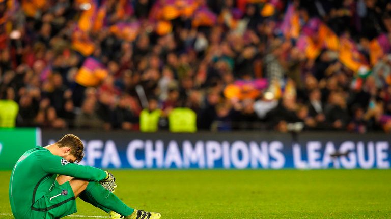 Kevin Trapp cuts a dejected figure on the pitch at Camp Nou after the 6-1 loss to Barcelona
