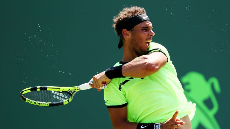 Rafael Nadal of Spain returns a shot against Fabio Fognini of Italy during Day 12 of the Miami Open