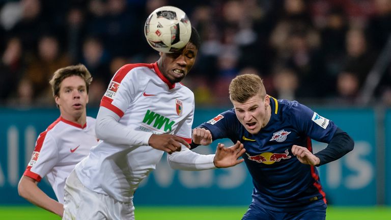 Augsburg's midfielder Kevin Danso and Leipzig's German striker Timo Werner (R) vie for the ball during the German first division Bundesliga football match 