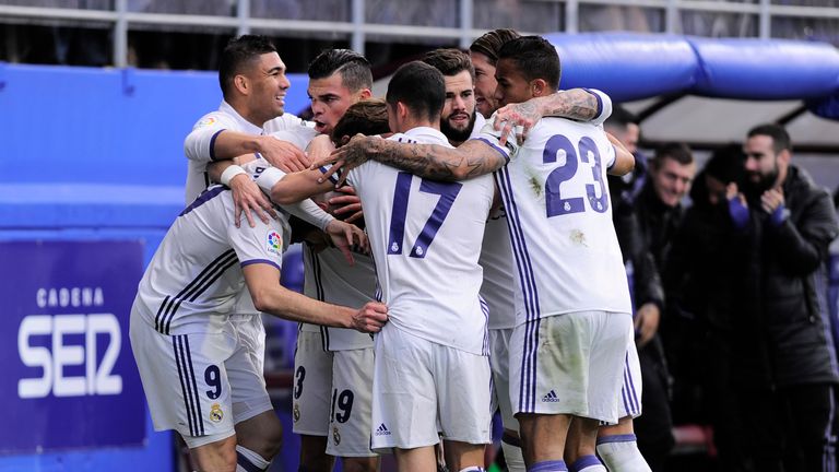 Real Madrid's players celebrate after Karim Benzema scoring their team's first goal during the Spanish league football match Eibar vs Real Madrid