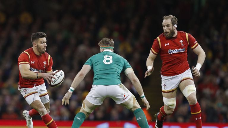 Wales' scrum-half Rhys Webb (L) looks to pass to Wales' lock Alun Wyn Jones (R) during the Six Nations match between Wales and Ireland 10.03.2017