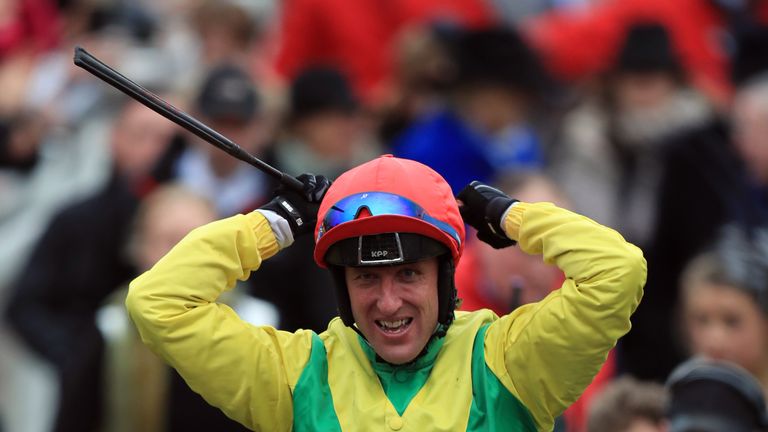 Robbie Power on Sizing John celebrates victory in the Timico Cheltenham Gold Cup on the final day of the 2017 Cheltenham Festival at Cheltenham Racecourse.