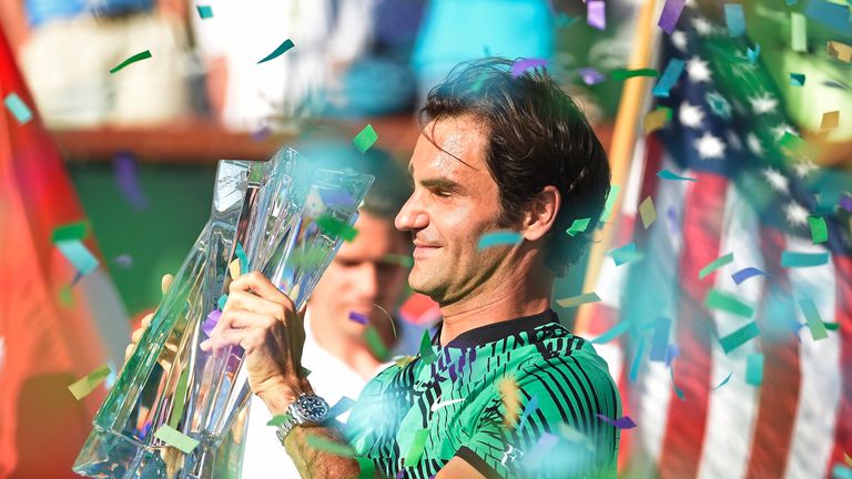 Roger Federer holds the BNP Paribas Open trophy after his straight sets victory against Stan Wawrinka at Indian Wells