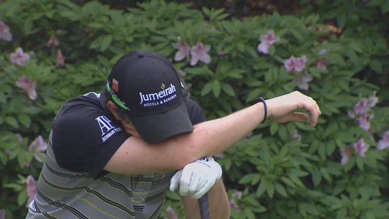 Rory McIlroy cannot hide his despair after pulling his drive into Rae's Creek at the 13th