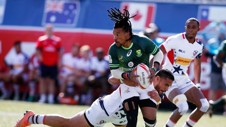 LAS VEGAS, NV - MARCH 05: Martin Iosefo of the United States tackles Rosko Specman of South Africa during the USA Sevens Rugby tournament at Sam Boyd Stadi