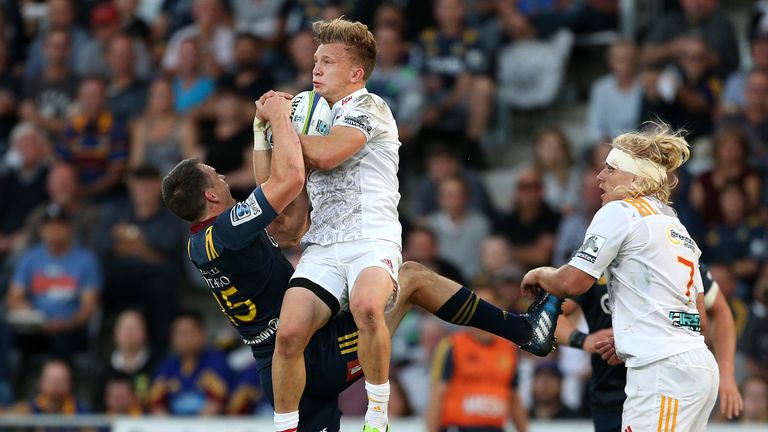 Ben Smith (left) contests a high ball with Chiefs full-back Damian McKenzie