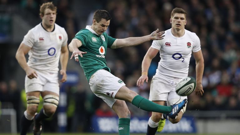 Johnny Sexton kicks downfield against England