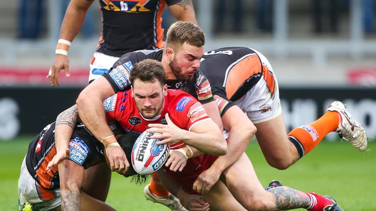 George Griffin is tackled by Castleford's Ben Roberts, Andy Lynch and Mike McMeeken