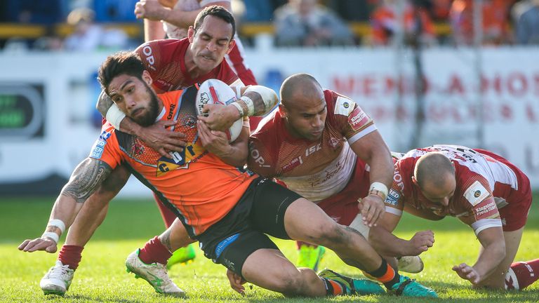 Jesse Sene-Lefao is tackled by Catalans' Paul Aiton, Sam Moa and Alrix Da Costa