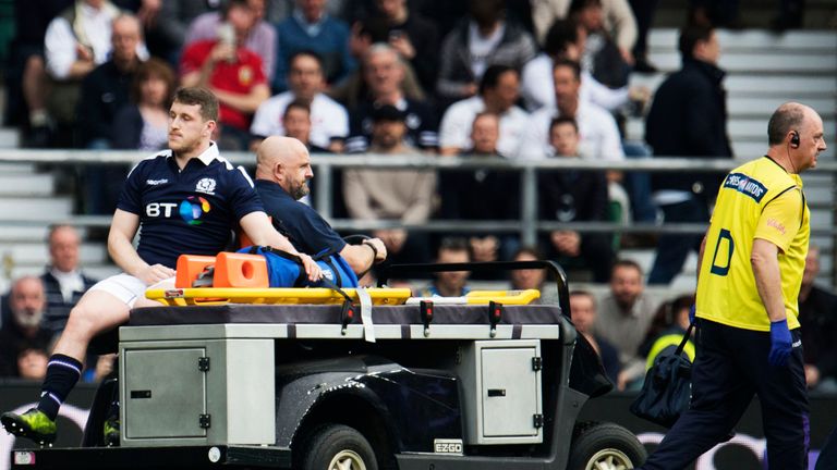 Scotland's Mark Bennett leaves the field injured against England