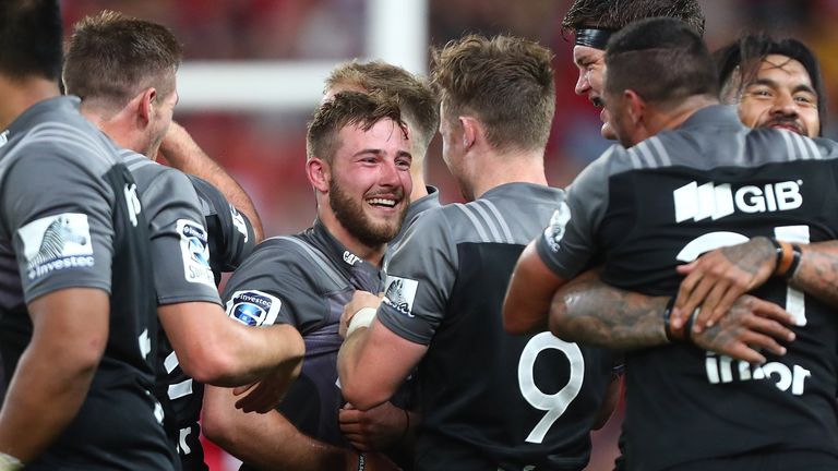 Mitchell Hunt (centre) is congratulated after kicking the winning penalty against the Reds