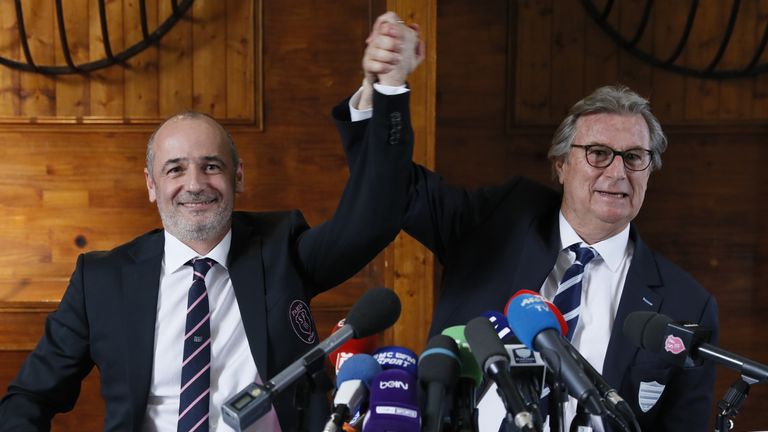 Racing 92 president Jacky Lorenzetti (R) and Stade Francais Paris president Thomas Savare (L) hold a press conference about the merger of their rugby clubs