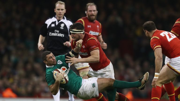 CARDIFF, WALES - MARCH 10 2017:  Rob Kearney of Ireland is tackled by Sam Warburton of Wales during the Six Nations match between Wales and Ireland