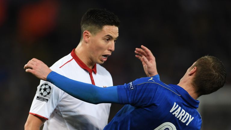 LEICESTER, ENGLAND - MARCH 14:  Samir Nasri of Sevilla and Jamie Vardy of Leicester City butt heads during the UEFA Champions League Round of 16, second le