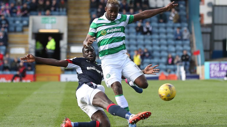 DUNDEE, SCOTLAND - MARCH 19:  Kevin Gomis of Dundee vies with Moussa Dembele of Celtic during the Ladbrokes Scottish Premiership match between Dundee and C