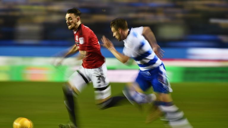 READING, ENGLAND - JANUARY 24:  Scott Malone of Fulham is chased by Chris Gunter of Reading during the Sky Bet Championship match between Reading and Fulha