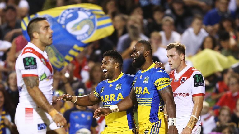 WOLLONGONG - MARCH 12 2017:  Semi Radradra of the Eels celebrates scoring a try with team mate Michael Jennings against the Dragons.