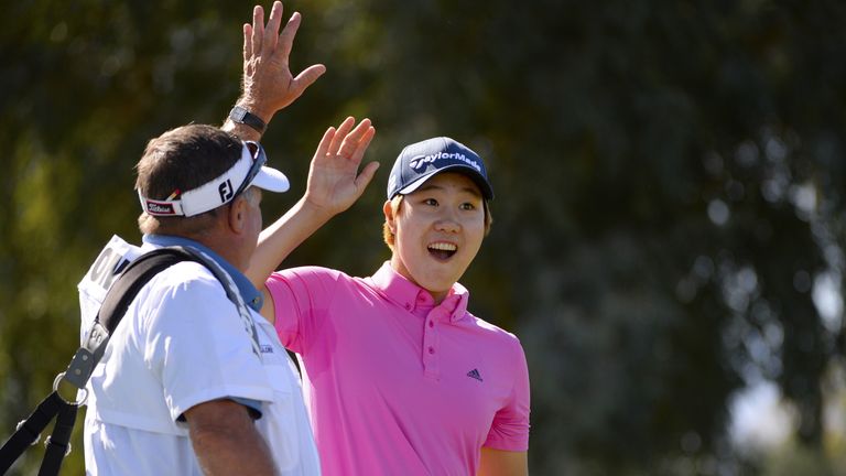 Eun Jeong Seong celebrates a hole in one with her caddie on the fifth hole during round one of the ANA Inspiration